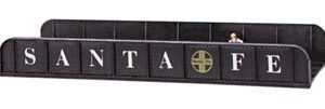 A black leather belt with letters on it.