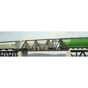 A train crossing over a bridge with green paint.