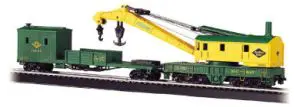 A green and yellow train with a crane on it