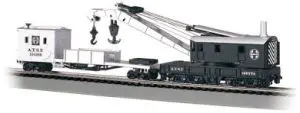 A train set with a crane and cars.