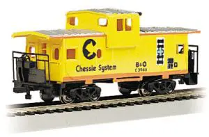 A yellow train car with the words chessie system on it.