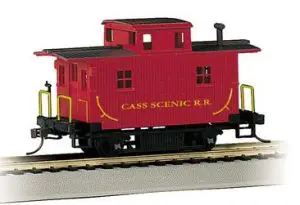 A red caboose on the tracks.