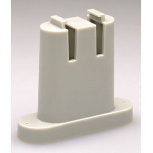A white plastic holder for two knives.