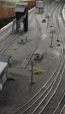 A train yard with many tracks and buildings.