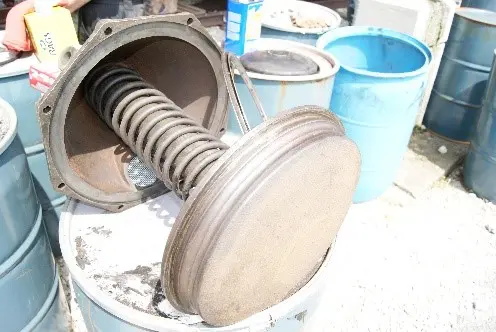 A close up of some buckets and a metal object