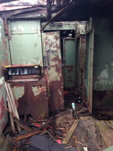 A room with many pieces of metal and rusted.