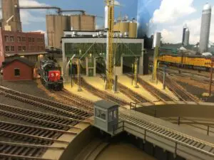 A train yard with trains and tracks in it