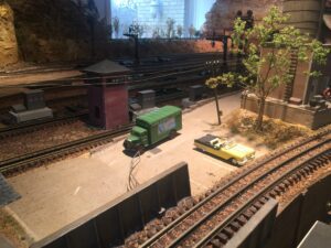 A model train set with trees and tracks.